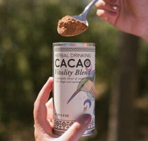 A spoonful of Herbal Drinking Cacao powder.